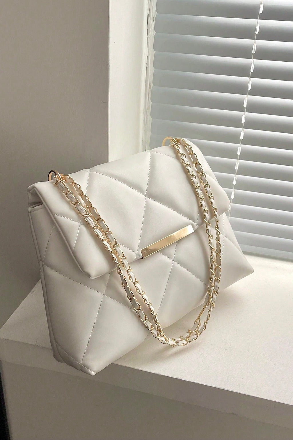 Borsa da donna a quadri con patta