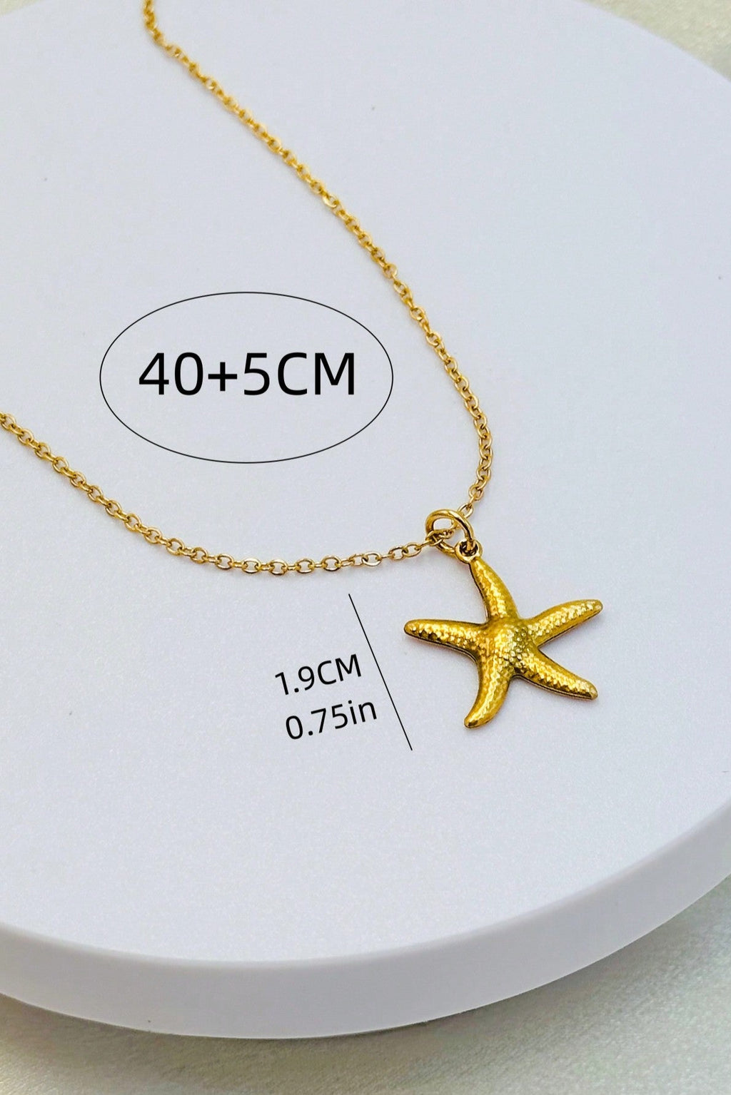 Collana a stella in acciaio inox color oro