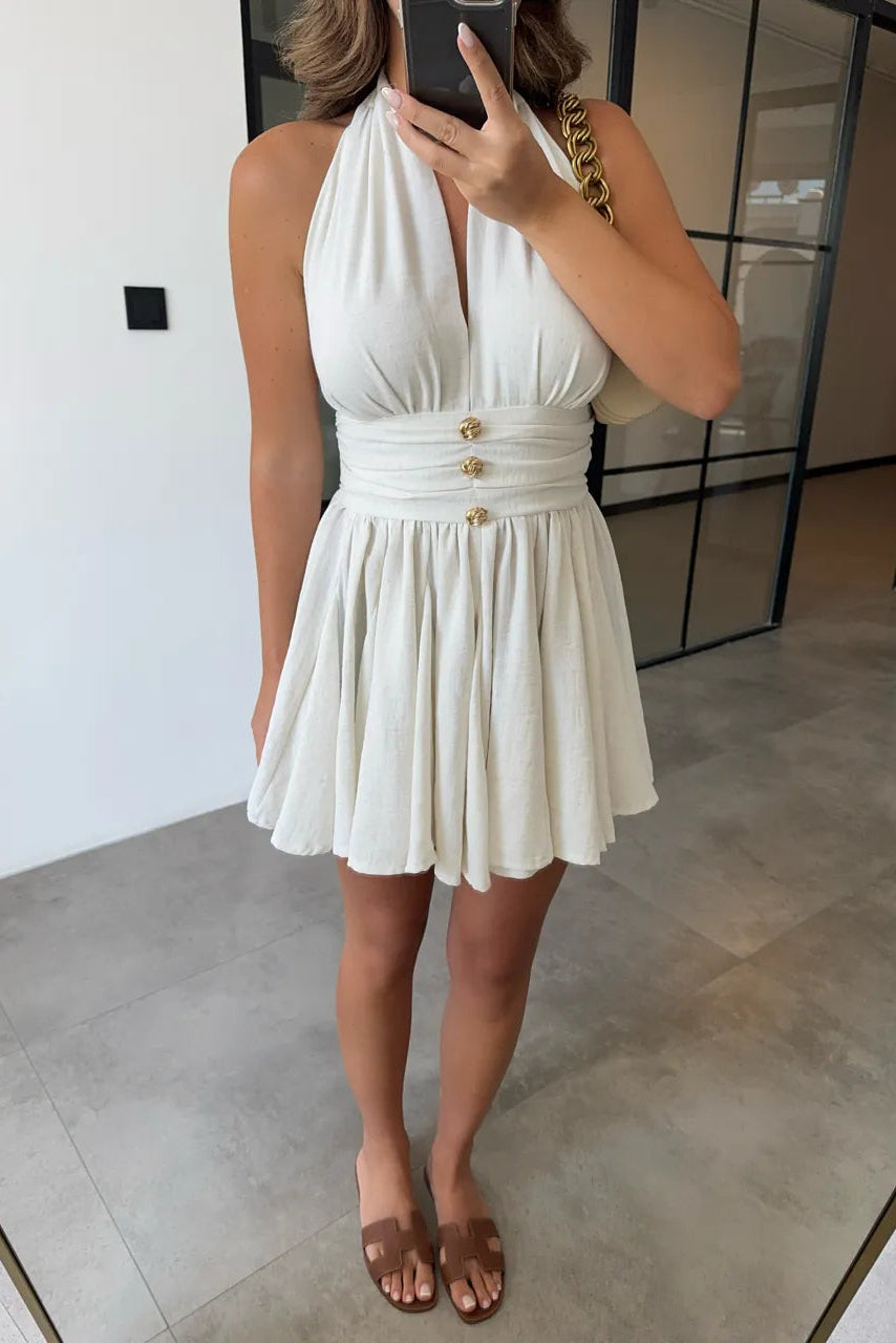 Vestido de lino con botones y lazada al cuello