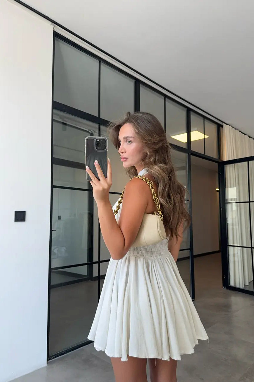 Vestido de lino con botones y lazada al cuello