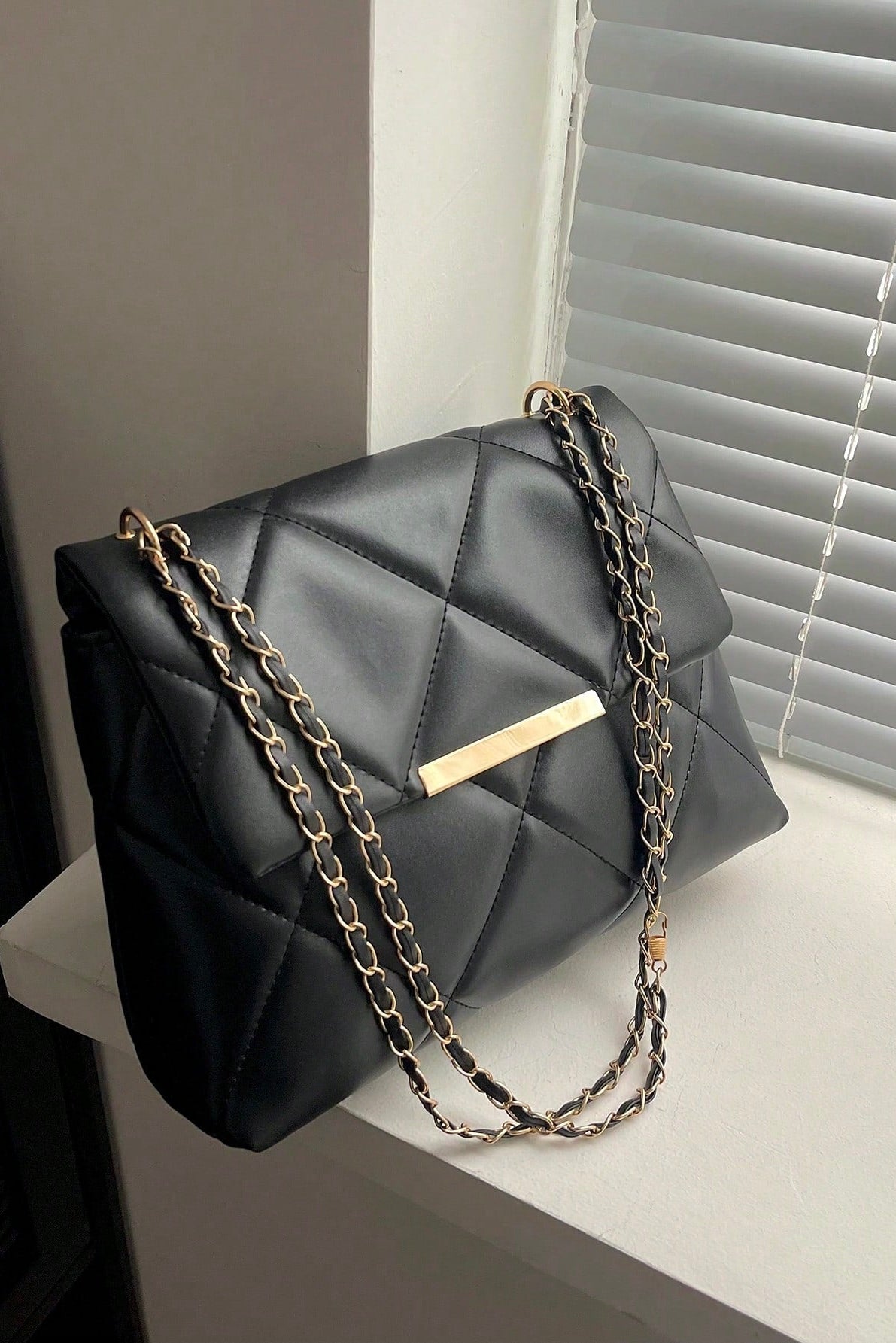 Borsa da donna a quadri con patta