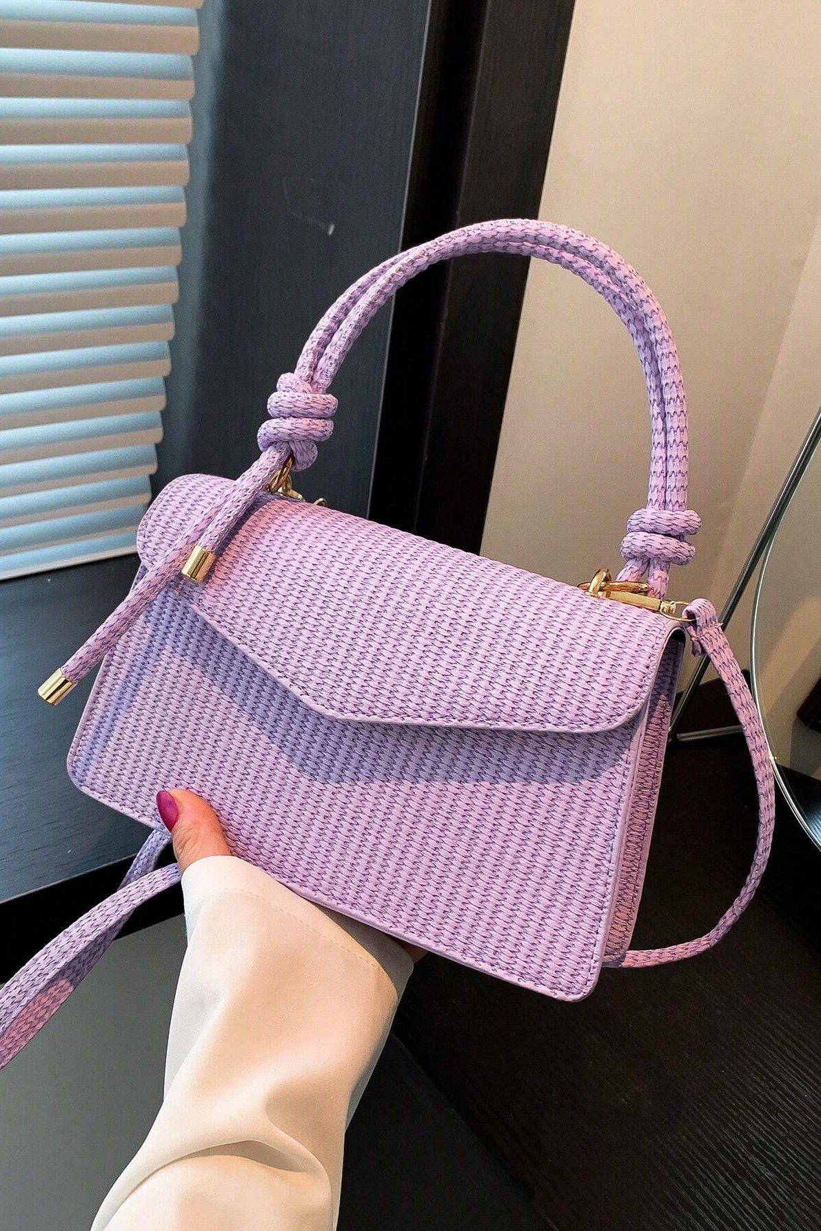 Mini borsa a mano e a tracolla con patta