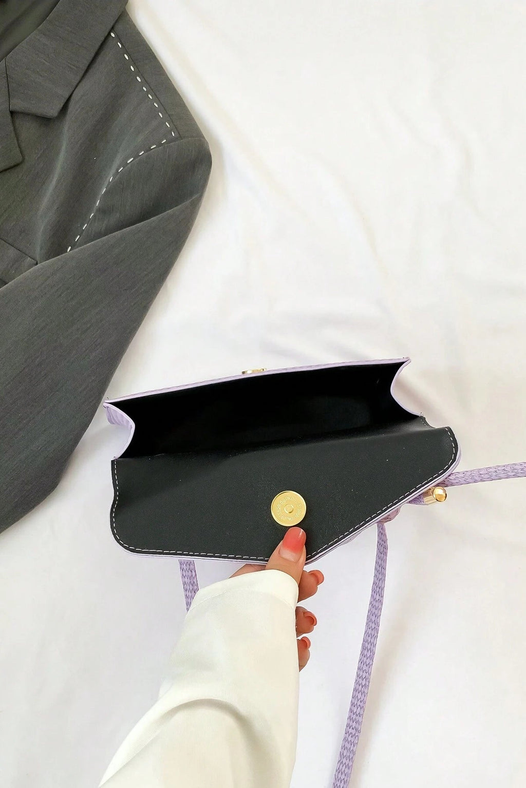 Mini borsa a mano e a tracolla con patta